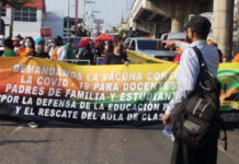 Trabajadores hondureños marchan para pedir vacunación y medidas ante pandemia
