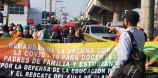 Trabajadores hondureños marchan para pedir vacunación y medidas ante pandemia