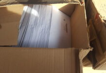 Encuentran un lote de cajas con más de 600 tarjetas del nuevo DIN botadas en La Ceiba