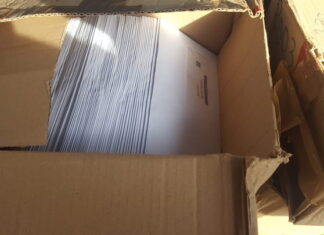 Encuentran un lote de cajas con más de 600 tarjetas del nuevo DIN botadas en La Ceiba