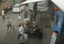 ¡Con un bebé en brazos! Comerciante se agarra a tiros con asaltantes en Comayagua