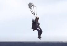 Paracaidista cae entre la gente en la gradería del Estadio Nacional