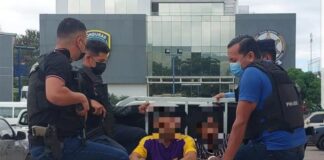 DPI captura en Tegucigalpa a dos supuestos gatilleros de la MS-13 con armas, chalecos antibalas y municiones