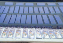 Agentes policiales hallan 210 mil dólares falsos y 35 paquetes de papel moneda en una caja fuerte en Danlí, El Paraíso