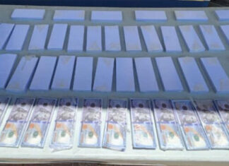 Agentes policiales hallan 210 mil dólares falsos y 35 paquetes de papel moneda en una caja fuerte en Danlí, El Paraíso